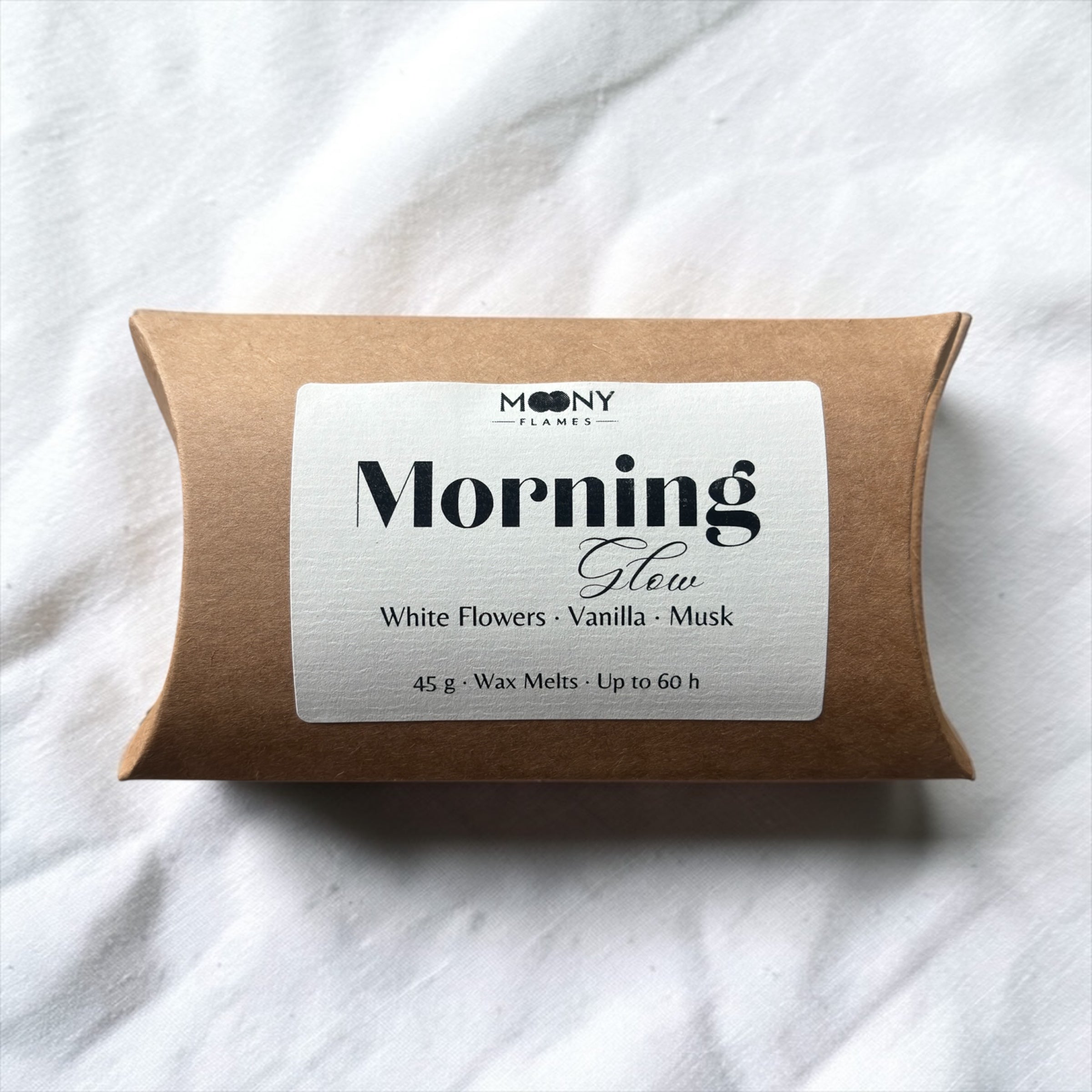 Moony Flames Morning Glow doftpraliner – handgjorda doftvax och wax melts med vita blommor, vanilj och mjuk mysk.